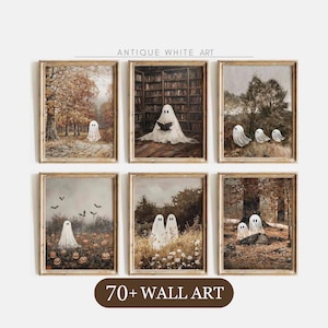 May include: A set of six framed wall art prints featuring ghosts in various settings, including a forest, a library, and a pumpkin patch. The prints have a muted, vintage color palette with brown, green, and white tones. Text reads ANTIQUE WHITE ART.