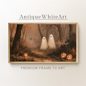 May include: A rectangular framed wall art piece featuring a dark, atmospheric forest scene with two white ghost figures standing in the center. The landscape includes glowing orange jack-o'-lanterns on the ground and silhouettes of birds.