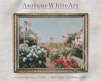 May include: A vintage print of a charming seaside scene with houses, flowers, and American flags. The print is framed in a gold-colored frame.