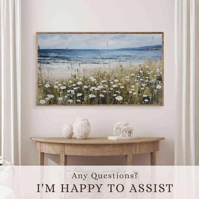 May include: A framed landscape painting depicts a coastal scene with a blue ocean, white flowers, and tall grasses. The artwork is displayed above a wooden console table with decorative vases and elephant figurines. The text "I'M HAPPY TO ASSIST" is at the bottom.
