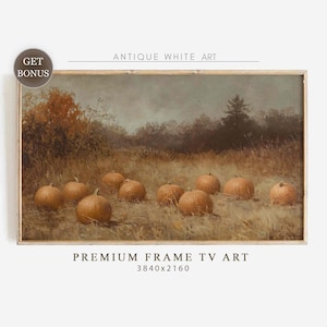 May include: A framed landscape painting featuring pumpkins in a field. The artwork has a vintage aesthetic, with a muted color palette of browns, oranges, and greens. The text "ANTIQUE WHITE ART" and "PREMIUM FRAME TV ART" are visible.