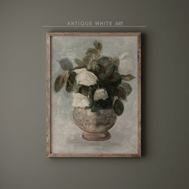 May include: A framed painting of a white flower bouquet in a vase. The flowers are white and the vase is a light brown color. The background is a light blue color.