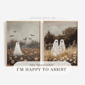 May include: Two framed art prints titled Antique White Art. The left print shows a white ghost in a pumpkin patch with bats in a grey sky. The right print features two white ghosts standing in a field of tall grass and white flowers.