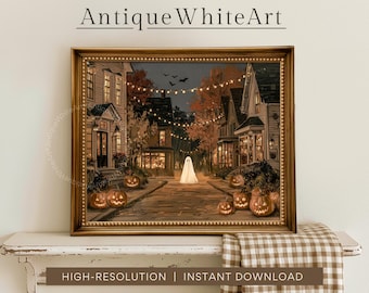 May include: A framed wall art print featuring a street scene at night with a white ghost standing in the center, surrounded by glowing orange jack-o'-lanterns, string lights, and autumn trees. The text AntiqueWhiteArt is visible at the top.
