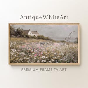 May include: Framed landscape art print featuring a field of wildflowers in shades of white, pink, and yellow, with a white house in the background. The text "Antique White Art" and "Premium Frame TV Art" are displayed.