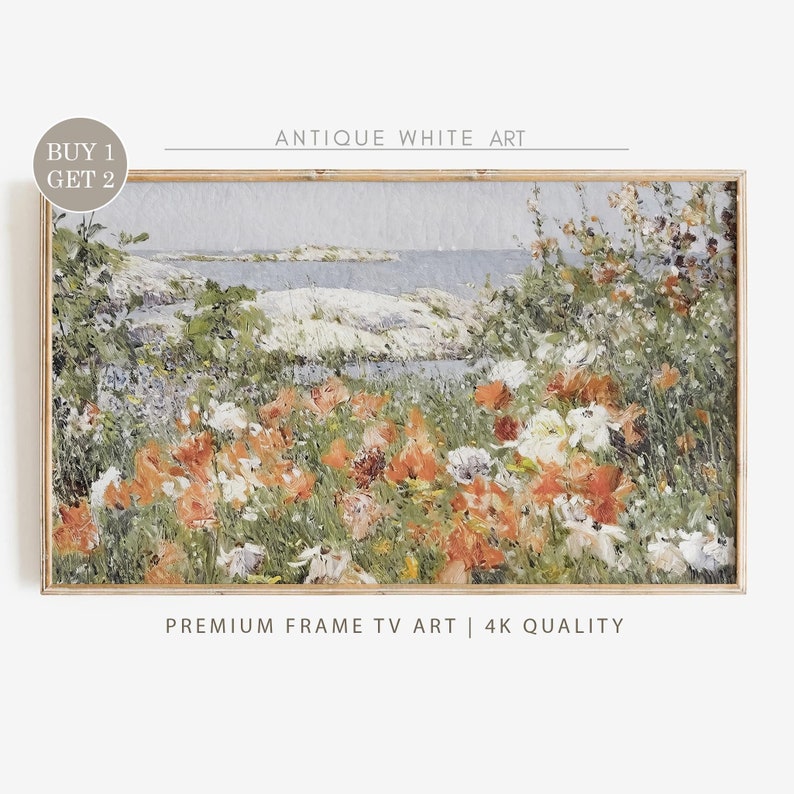 May include: A framed painting of a coastal landscape with a field of orange and white flowers in the foreground. The painting has a light blue sky and a body of water in the background. The text "ANTIQUE WHITE ART" is at the top of the frame and "PREMIUM FRAME TV ART | 4K QUALITY" is at the bottom.
