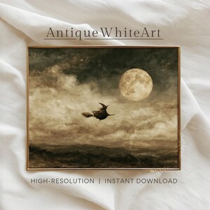 May include: A rectangular framed wall art print titled Antique WhiteArt featuring a sepia-toned landscape painting of a silhouette of a figure on a broomstick flying across a cloudy night sky with a large full moon above a dark horizon.