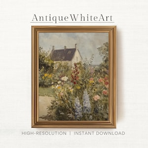 Puede incluir: Una pintura vintage de una casa blanca con techo marrón rodeada de un jardín exuberante con flores de colores. La pintura está enmarcada en un marco dorado.
