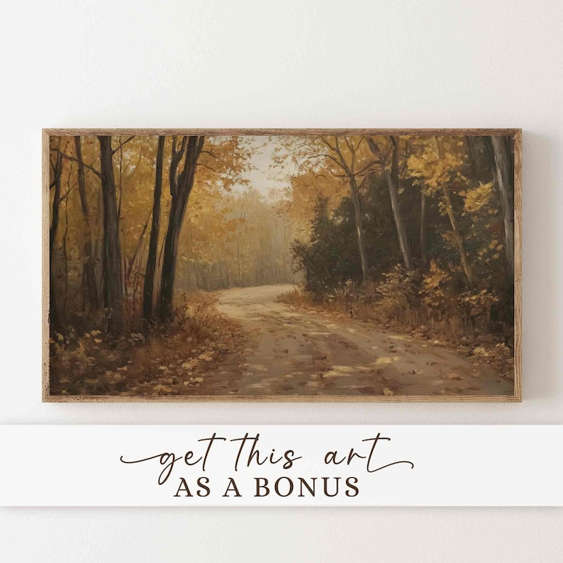 May include: A framed landscape painting shows a winding dirt track through an autumn forest. The trees have yellow and brown leaves, with a soft, hazy light in the distance. The text "get this art AS A BONUS" is at the bottom.