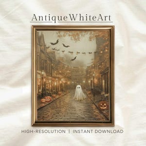 May include: A framed print titled "Antique White Art" depicts a spooky Halloween scene. A ghost walks down a cobblestone street lined with lit lanterns and jack-o'-lanterns. Bats fly overhead. The words "HIGH-RESOLUTION | INSTANT DOWNLOAD" are at the bottom.