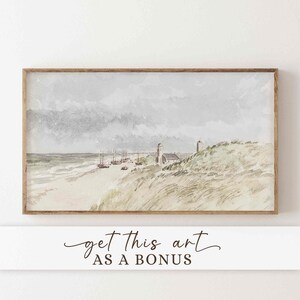 May include: Watercolor painting of a coastal scene with a beach, boats, and buildings under a cloudy sky. The artwork is framed in a wooden frame. The text "get this art as a bonus" is at the bottom.