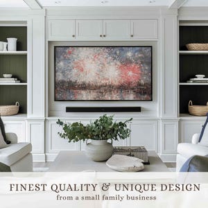 May include: A living room entertainment center with a large framed artwork depicting fireworks. The room features white cabinetry, a gray coffee table, and a decorative vase with greenery. The text at the bottom reads "FINEST QUALITY & UNIQUE DESIGN from a small family business."