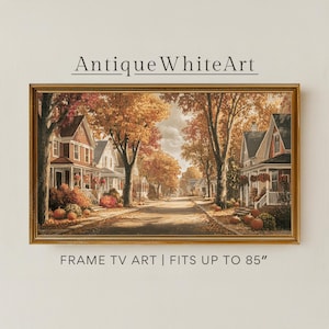 May include: A rectangular framed digital print titled AntiqueWhiteArt, featuring a suburban street scene in autumn with orange-leafed trees, houses, and pumpkins. The text below reads FRAME TV ART | FITS UP TO 85". The frame is gold-toned.