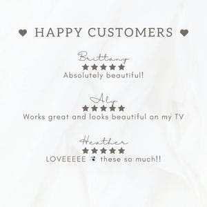 May include: A light beige graphic with the text "HAPPY CUSTOMERS" and customer reviews. The reviews include star ratings and comments such as "Absolutely beautiful!" and "Works great and looks beautiful on my TV."