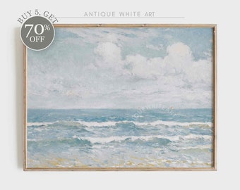 May include: A framed painting of a seascape with blue water and white clouds in the sky. The painting is in a light wood frame.