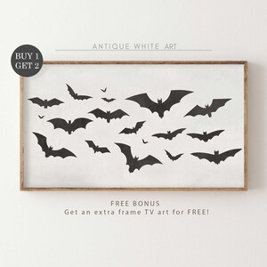 May include: A black and white printable art print featuring a silhouette of bats flying in a white background. The print has a rustic wood frame and the text "Antique White Art" and "FREE BONUS Get an extra frame TV art for FREE!" is printed below the image.