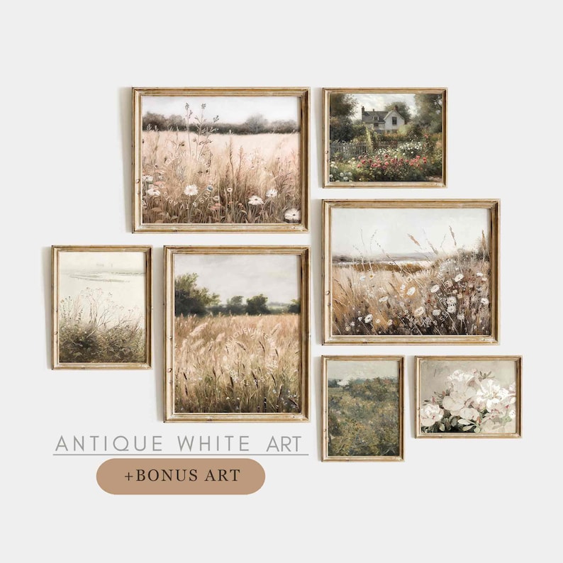May include: A set of 7 framed prints featuring vintage-style landscape paintings with a rustic aesthetic. The prints depict scenes of fields, flowers, and a small cottage. The frames are a light wood color.