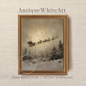 May include: A framed wall art print titled AntiqueWhiteArt featuring a painting of Santa Claus in a sleigh pulled by reindeer flying over a snowy forest landscape with pine trees under a soft glowing sky. The frame is a metallic gold colour.