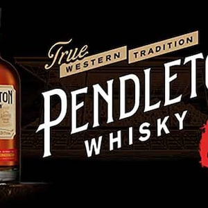 May include: A bottle of Pendleton Whisky with a red and white label. The label says "Pendleton Whisky" and "True Western Tradition". The bottle is sitting on a wooden surface.