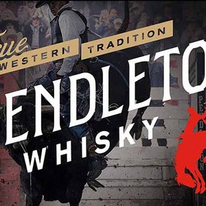 May include: A white and black logo for Pendleton Whisky. The logo features the words "Pendleton Whisky" in a stylized font. The words "True Western Tradition" are in a smaller font above the main logo. The logo is set against a background of a rodeo scene with a cowboy riding a bucking bronco.