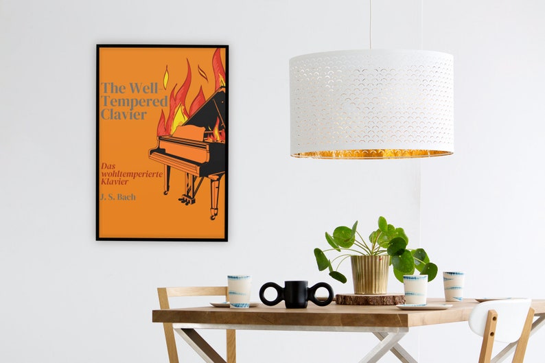 May include: A poster with an orange background and a black grand piano on fire. The text on the poster reads "The Well Tempered Clavier" and "Das wohltemperierte Klavier J.S. Bach".
