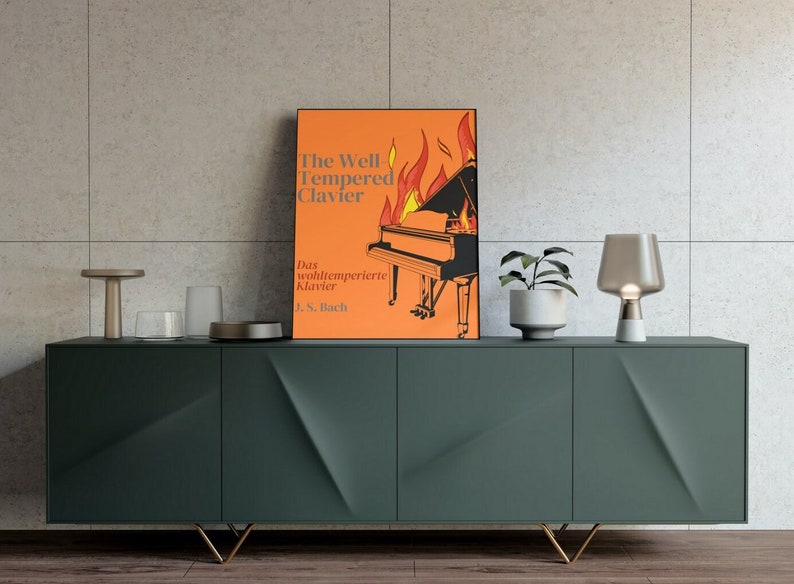 Orange Firey poster with a piano on fire. Bach's well tempered clavier poster