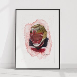 May include: A watercolor painting of a person wearing a red and gold helmet with a tiger face design. The helmet has a red mouth with sharp teeth and a gold nose. The background is a soft pink watercolor wash.