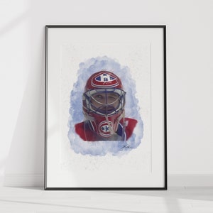 May include: A watercolour painting of a hockey goalie wearing a red, white and blue jersey and a blue and white mask. The goalie is looking directly at the viewer with a determined expression. The background is a soft blue watercolour wash.