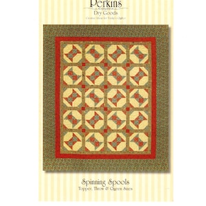 May include: A quilt pattern booklet titled Perkins Dry Goods #150 Spinning Spools Topper, Throw & Queen Sizes. The cover features a quilt with a repeating block design in cream, red, and muted blue-green, framed by a red border and a green floral border.