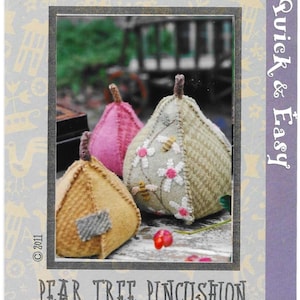 May include: Image of three pear-shaped pincushions in pink, tan, and green. The largest has floral and bee embroidery. The text "Hatched and Patched" and "Quick & Easy" are visible. The finished sizes are 6.35cm and 8.89cm high.