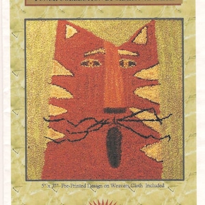 May include: A punch needle embroidery kit titled "Scaredy Cat" by Sharon A. Smith. The design features a stylized orange cat with yellow accents. The kit includes a pre-printed design on weavers cloth, measuring 5" x 7". The kit is part of the "French Fantasy Designs" collection.