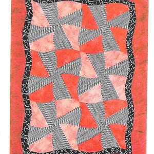May include: A quilt with a red background and a pattern of alternating red and black and white striped squares. The quilt has a black and white patterned border.