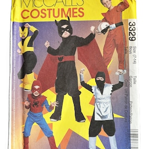 May include: A sewing pattern for children's costumes. The pattern includes four different costumes: a black and red superhero costume, a yellow and black superhero costume, a red and blue superhero costume, and a black and silver ninja costume. The pattern is for sizes 7-14. The pattern number is 3329.