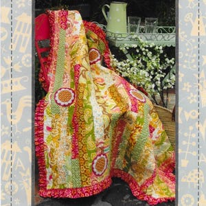 May include: A vibrant patchwork quilt with floral and paisley designs in pink, green, and yellow. The quilt has a ruffled edge and is draped over a red chair. The text "Hatched and Patched" and "Happy Days" are visible.