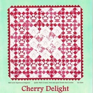 May include: A quilt pattern booklet titled Alex Anderson Classics Cherry Delight. The cover features a red and white quilt design with basket and cherry motifs, set against a light green background. Text includes Skill Level: Experienced Beginner.