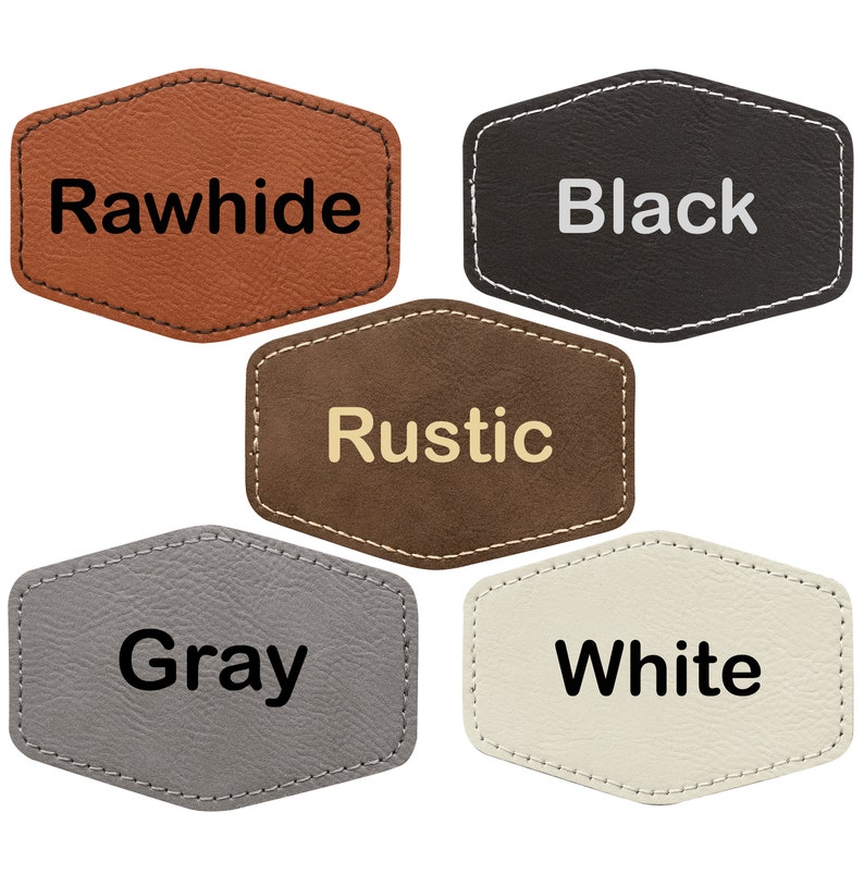 May include: Five leather patches in different colors with the words "Rawhide", "Black", "Rustic", "Gray", and "White" written on them.