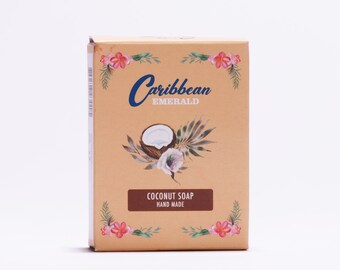 May include: A brown box with a white background and a floral design. The box has the text "Caribbean Emerald" and "Coconut Soap Hand Made" on it.