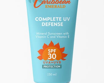 Op de afbeelding: Een turquoise tube Caribbean Emerald zonnebrandcrème. Het etiket toont de merknaam in oranje script, de woorden "COMPLETE UV DEFENSE" en "SPF 30". Het bevat 150 ml zonnebrandcrème.