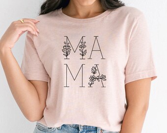 May include: A pink t-shirt with a black graphic that says "MAMA" with floral accents.