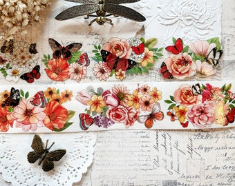 Könnte beinhalten: Eine Rolle Washi-Tape mit einem floralen Design mit roten, rosa und gelben Blumen, Schmetterlingen und goldenen Akzenten. Das Band befindet sich auf einem weißen Hintergrund mit einer Libelle und einer Spitze.