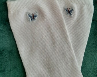 Hand embroidered socks with delicate blue butterfly pattern