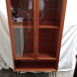 Mid Century Teak Bookcase Unit With Wooden Framed Glass Doors On Hairpin Legs