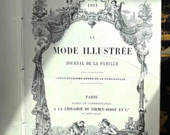 May include: Open book page with the title "LA MODE ILLUSTRÉE" and the year "1881" in ornate black lettering. The page has decorative borders with cherubs and floral designs. The text "JOURNAL DE LA FAMILLE" is also visible.