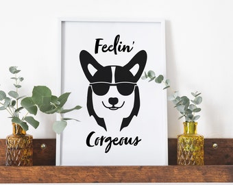 May include: A white framed print with a black and white illustration of a corgi wearing sunglasses. The text "Feelin' Corgeous" is below the image.