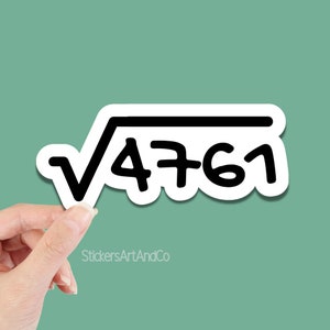 May include: A white sticker with a black outline featuring a square root symbol over the number 4761. The sticker is held by a hand against a teal background. The text "StickersArtAndCo" is at the bottom.