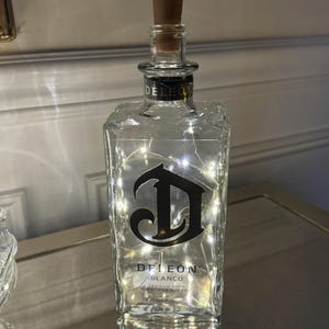 Repurposed Deleon tequila bottle with LED string lights. Perfect Gift for Mother’ day.