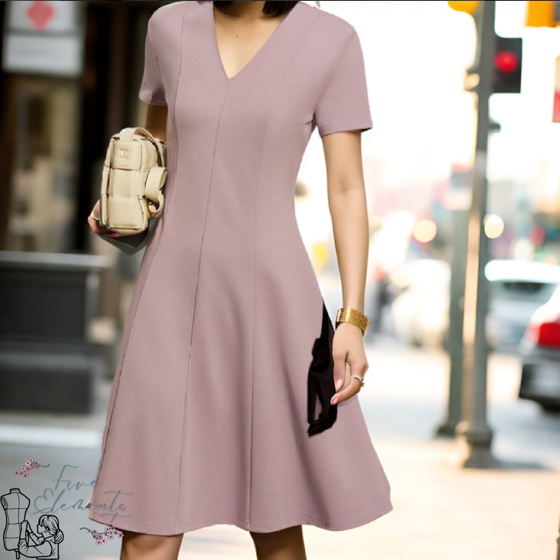 May include: A mauve-colored dress with a v-neckline and short sleeves. The dress has a fitted bodice and a flared skirt.