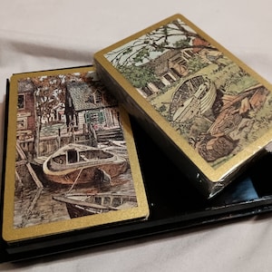 Vintage Schroeder Firestone Tyre dubbele speelkaarten: één kaartspel is verzegeld.