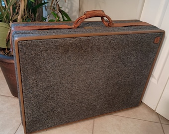 Vintage large Hartmann Luggage with wheels tweed rolled leather grips and button straps