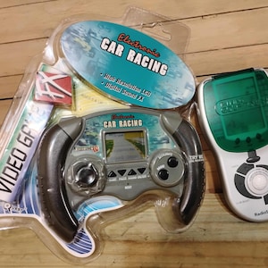 Vintage Radio Shack talking golf tour and toy quest electronic FX racing game